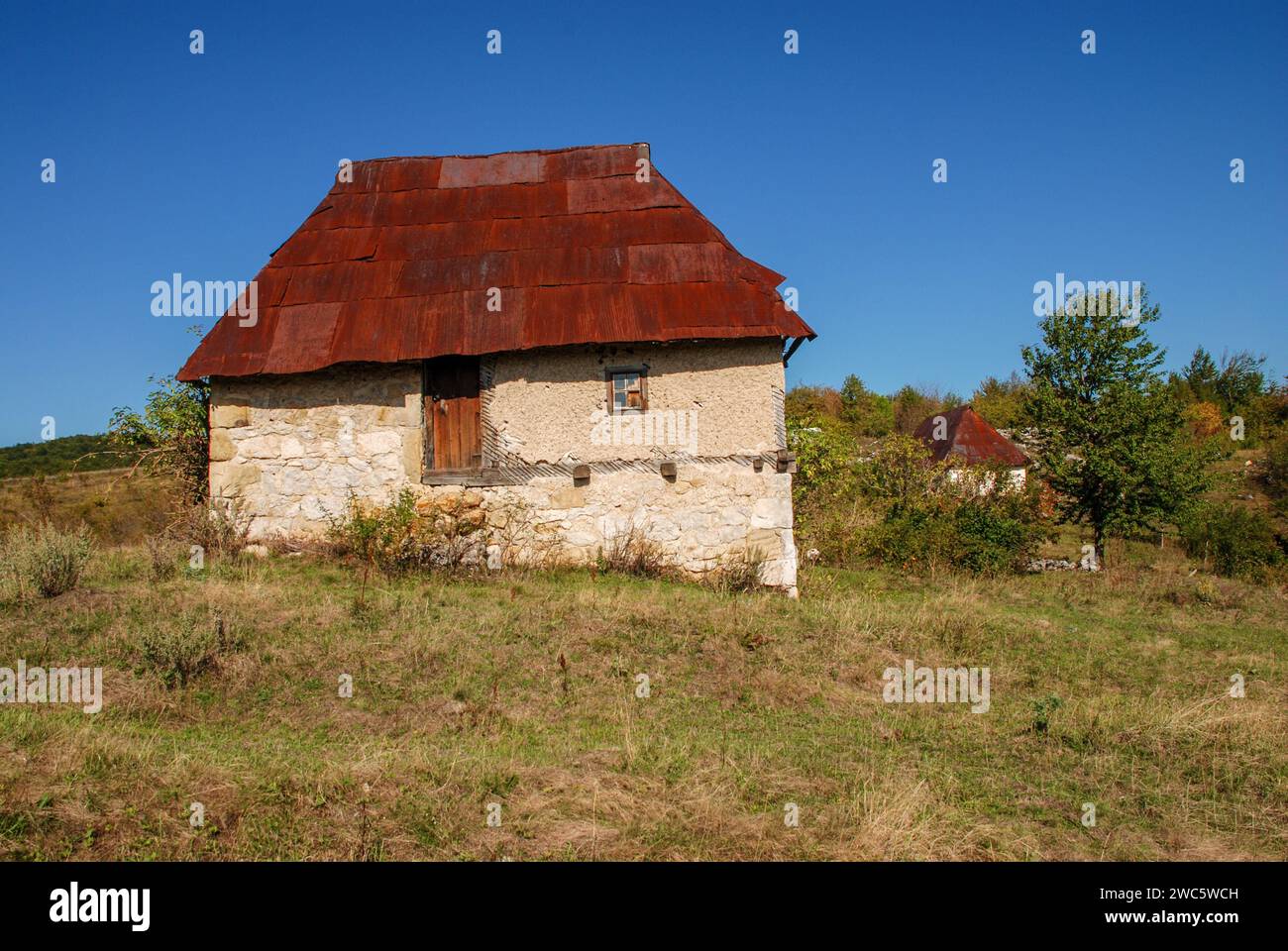 Old stone houses in mountain. Traditional stone house in Bosnia and ...