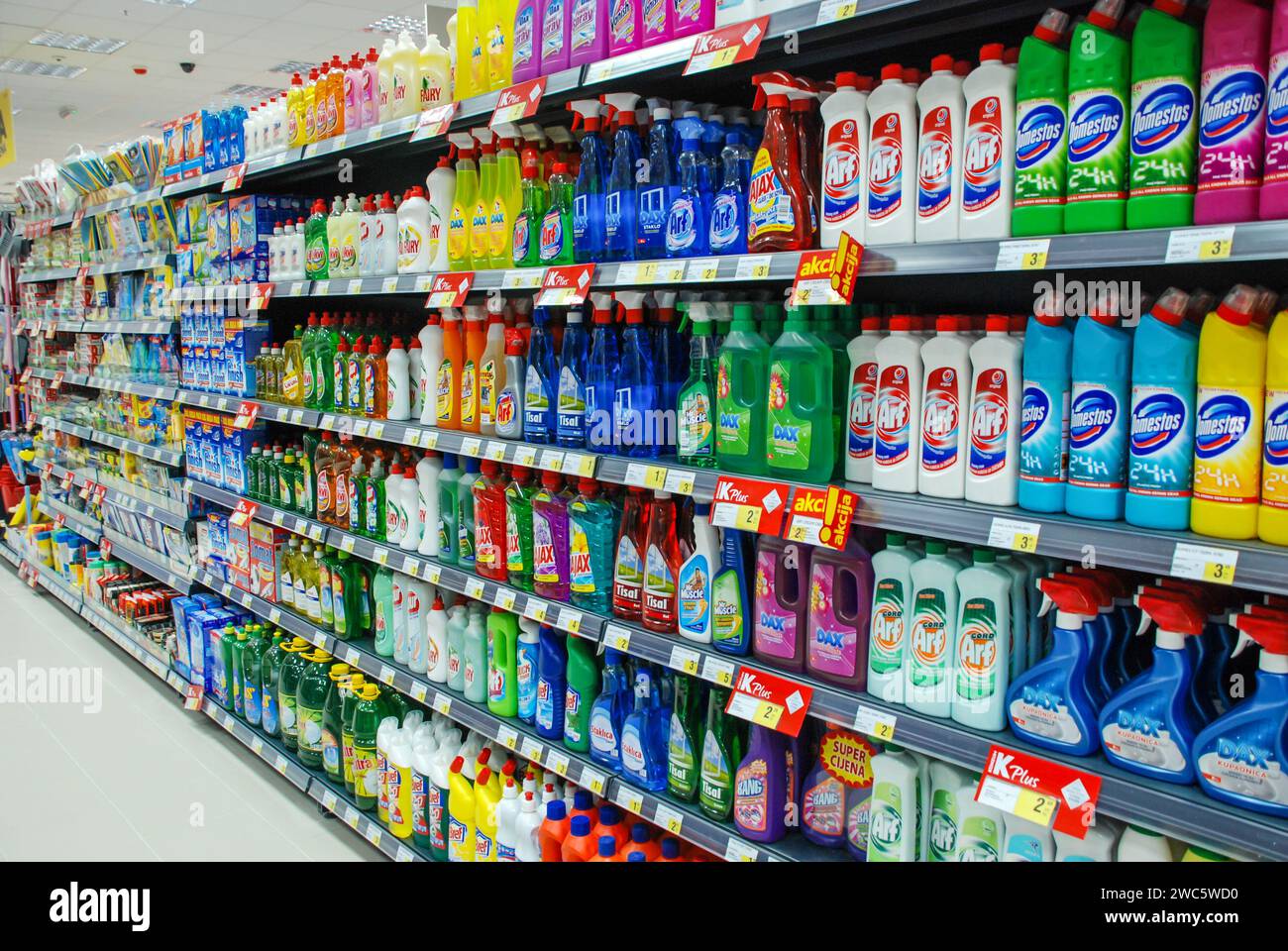 Laundry detergent on shelves in supermarket. Washing powder on shelves in market. Cleaning products  for household. Shopping Stock Photo