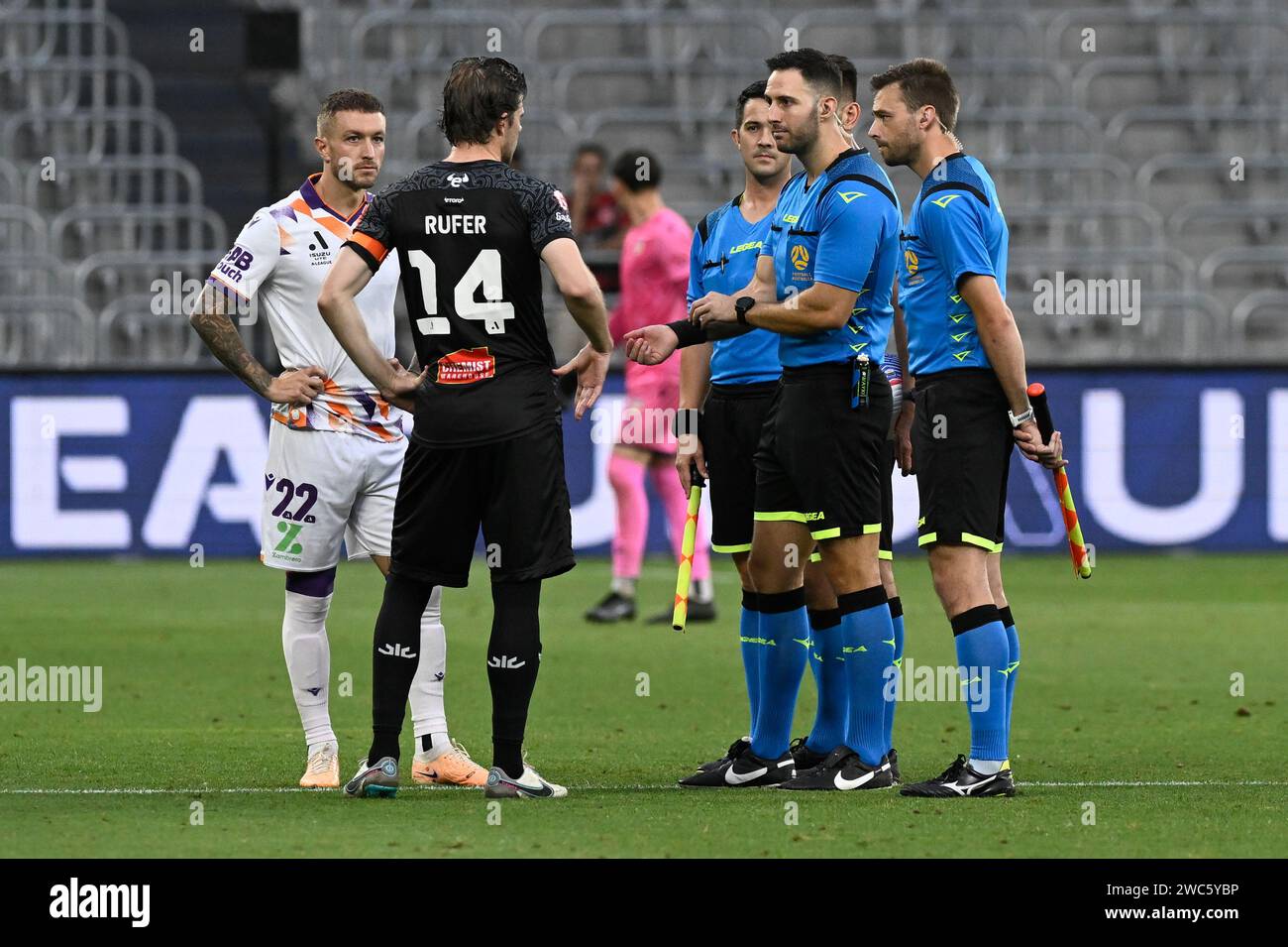 14th January 2024; CommBank Stadium, Sydney, NSW, Australia: A-League Football, Perth Glory versus Wellington Phoenix; captains Adam Taggart of Perth Glory and Alex Rufer of Wellington Phoenix during the coin toss with referee Adam Kersey Stock Photo