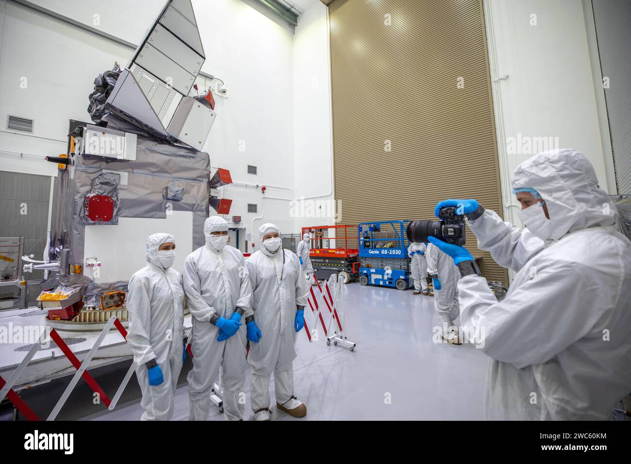 Members of NASA’s PACE (Plankton, Aerosol, Cloud, ocean Ecosystem) team are photographed with the spacecraft on Wednesday, Jan. 3, 2024, during a NASA Stock Photo