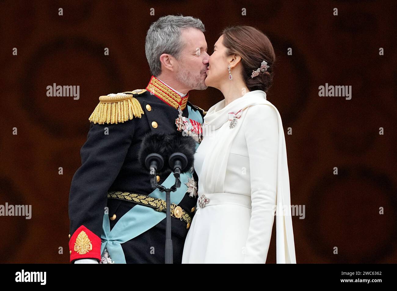 Denmark's King Frederik X kisses his wife Denmark's Queen Mary on the