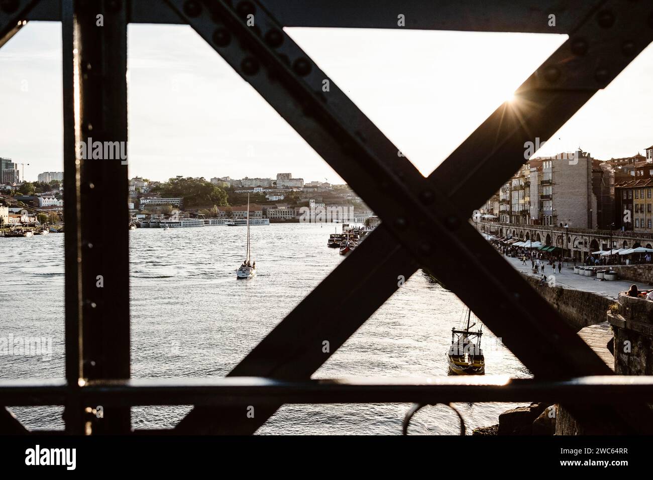 Sunset view of riverside in Porto with famous iron bridge in the front, north Portugal Stock Photo