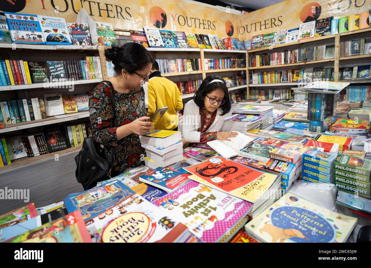 Book readers browsing books at a stall during Assam Book Fair, in