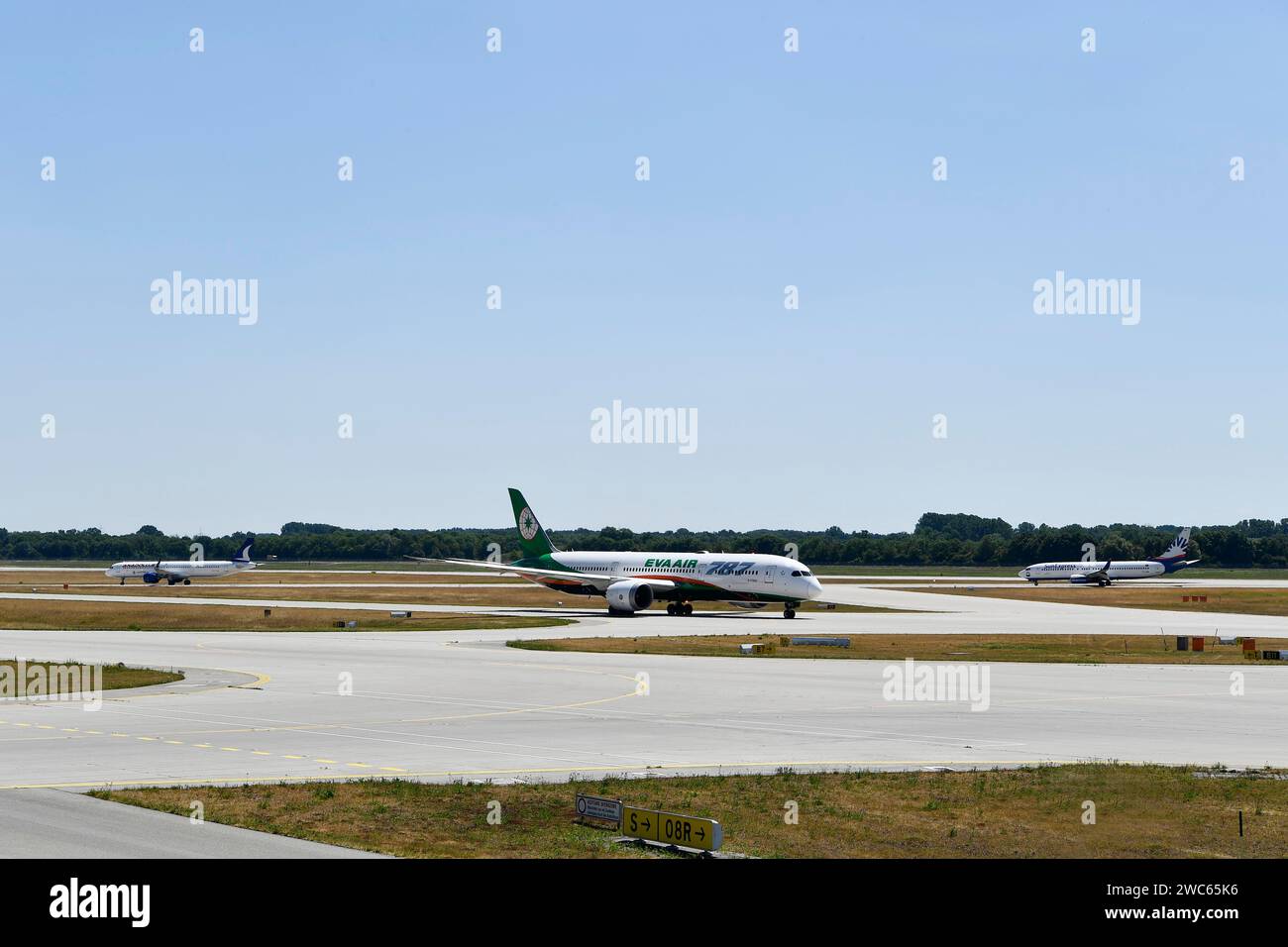 Eva Air Dreamliner, SunExpress and Anadolujet Airlines aircraft taxiing on the taxiways at Runway South, Munich Airport, Upper Bavaria, Bavaria Stock Photo