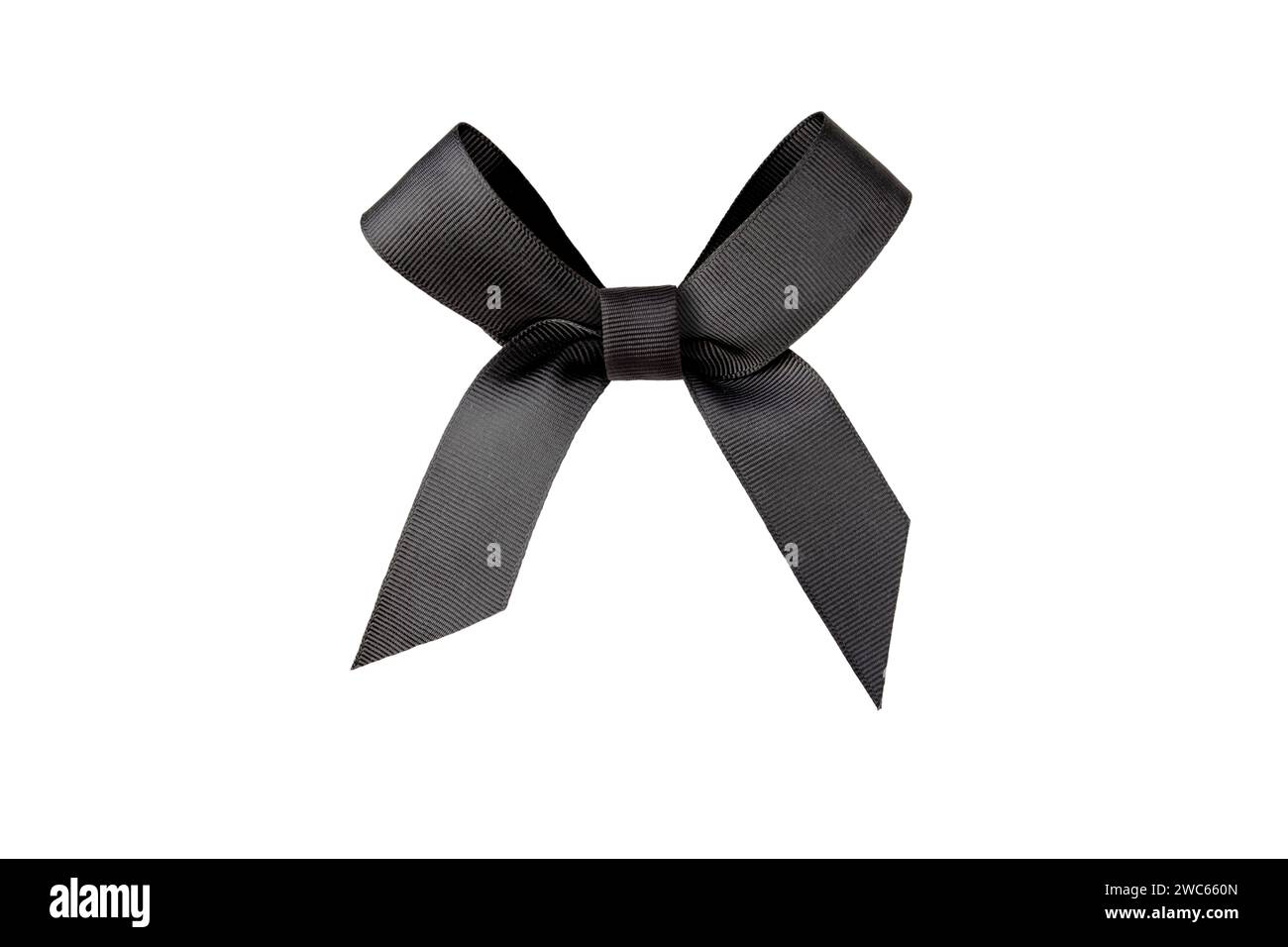 Black satin bow isolated on white. Dark elegant shiny ribbon tied knot. Mourning crepe. Stock Photo