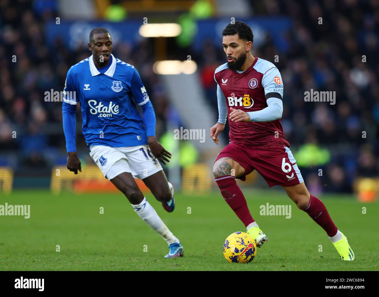 Liverpool, UK. 14th Jan, 2024. Douglas Luiz of Aston Villa moves ahead of Abdoulaye Doucoure of Everton during the Premier League match at Goodison Park, Liverpool. Picture credit should read: Gary Oakley/Sportimage Credit: Sportimage Ltd/Alamy Live News Stock Photo