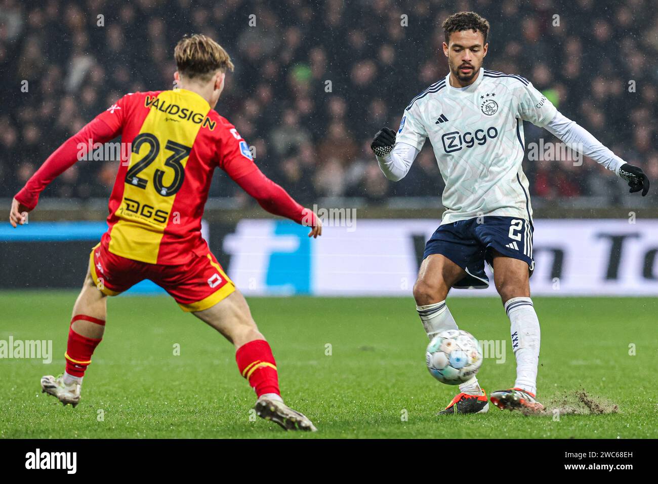 DEVENTER, NETHERLANDS - JANUARY 14: Oliver Edvardsen of Go Ahead Eagles tries to stop Devyne Rensch of AFC Ajax during the Dutch Eredivisie match between Go Ahead Eagles and AFC Ajax at De Adelaarshorst on January 14, 2024 in Deventer, Netherlands. (Photo by Peter Lous/Orange Pictures) Stock Photo