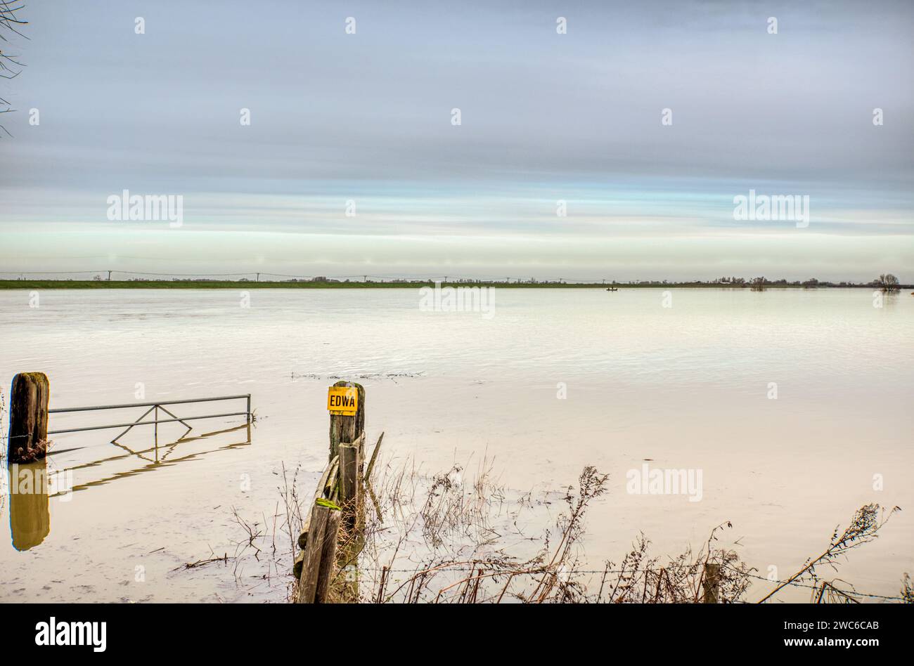 Farm gate in flood plain between the Old Bedford River and the Hundred Foot Drain, Sutton Gault, Sutton-in-the-Isle, near Ely, Cambridgeshire, UK Stock Photo