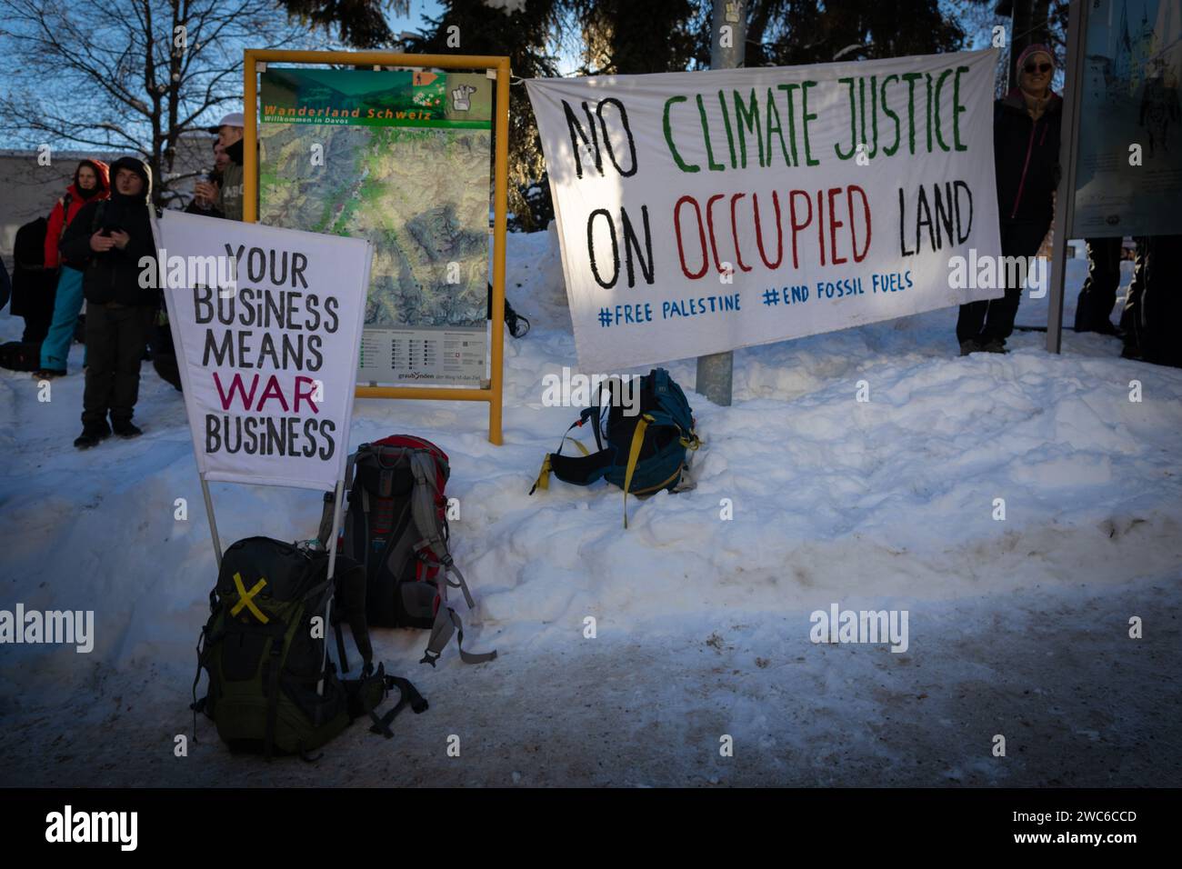 Davos, Switzerland. 14th Jan, 2024. Davos, CH 14 January, 2024. Banners are placed around the rally against 54th World Economic Forum. Hundreds of protesters gathered to voice concerns about this year's WEF agenda. The Forum engages society's political, business, and cultural leaders to shape global, regional, and industry agendas, which can impact everyone around the world. Credit: Andy Barton/Alamy Live News Stock Photo