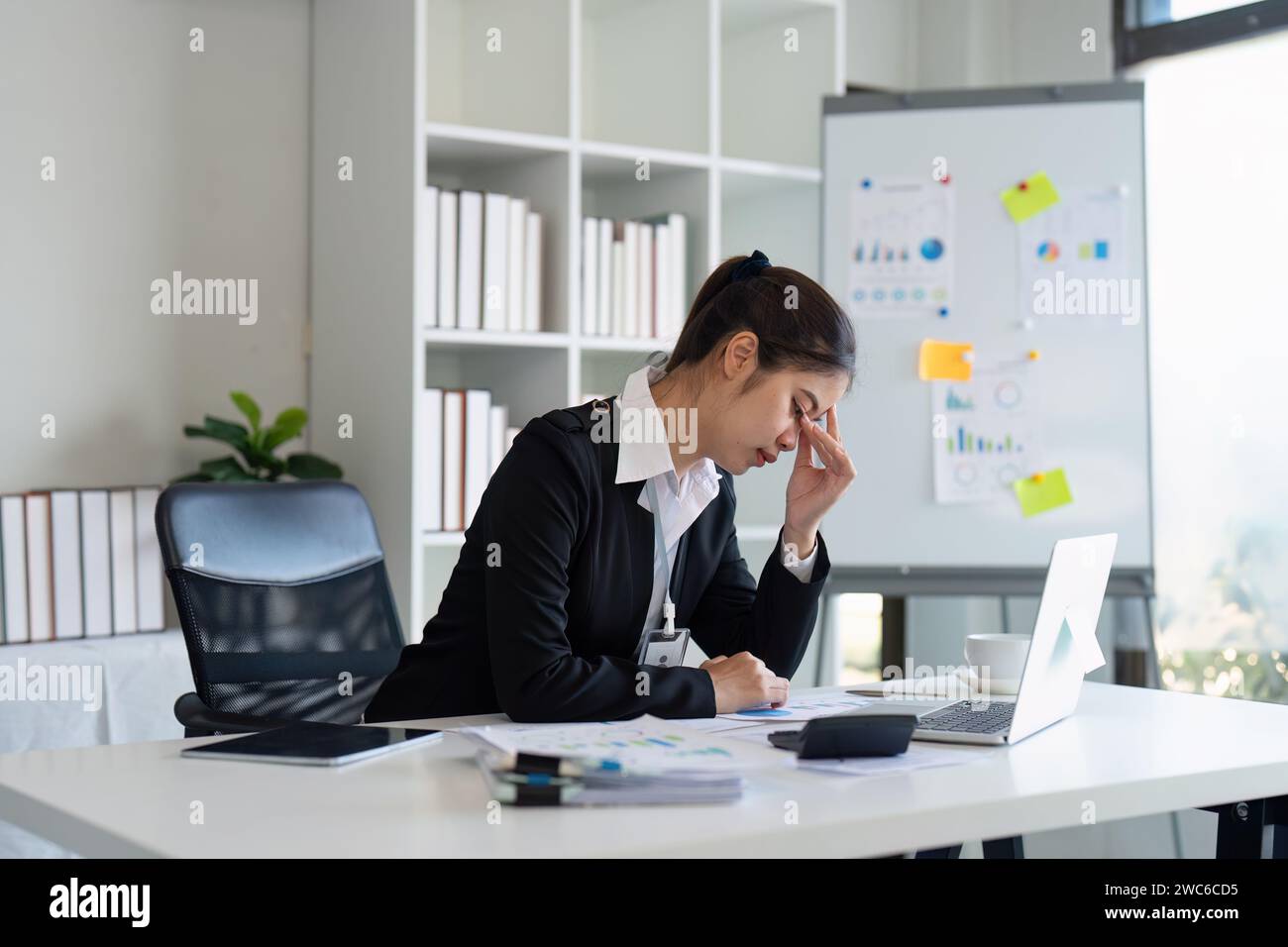 Business woman stress and headache report and planning, research ...