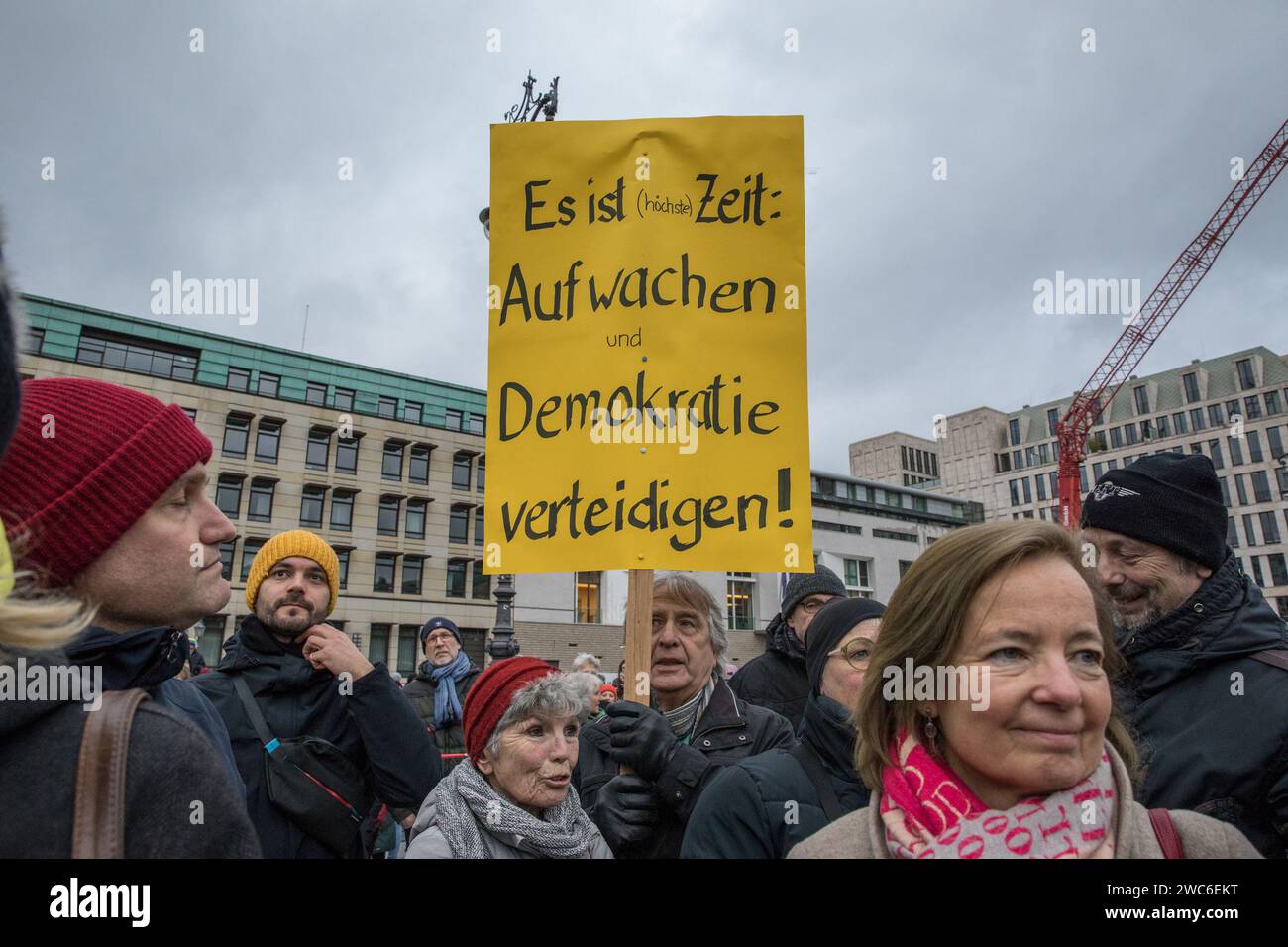 Berlin, Germany. 14th Jan, 2024. In an unparalleled show of solidarity, the streets of Berlin on January 14, 2024, echoed with the voices of 25,000 protesters as they converged at Pariser Platz in the shadow of the iconic Brandenburg Gate. The demonstration, orchestrated by Fridays for Future Berlin and backed by an extensive coalition of civil society groups, NGOs, and activists, marked a decisive stand against right-wing extremism and a relentless defense of democratic values. Under the theme ''We Stand Together'' was a direct response to the chilling findings of an investigative report by Stock Photo