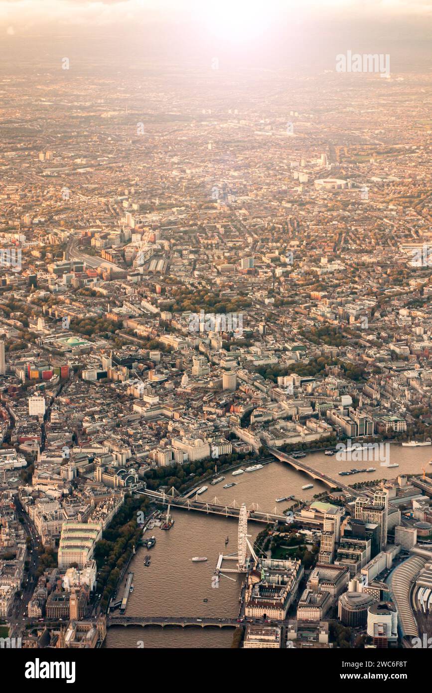 London Eye, Big Ben and sprawling London at sunset from above Stock Photo
