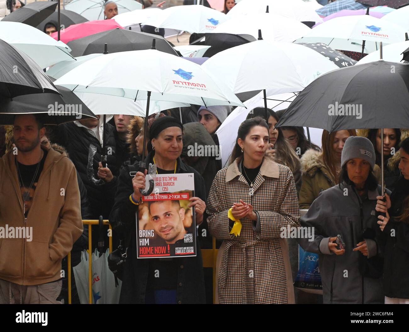 Jerusalem, Israel. 14th Jan, 2024. Hostage families hold posters at a