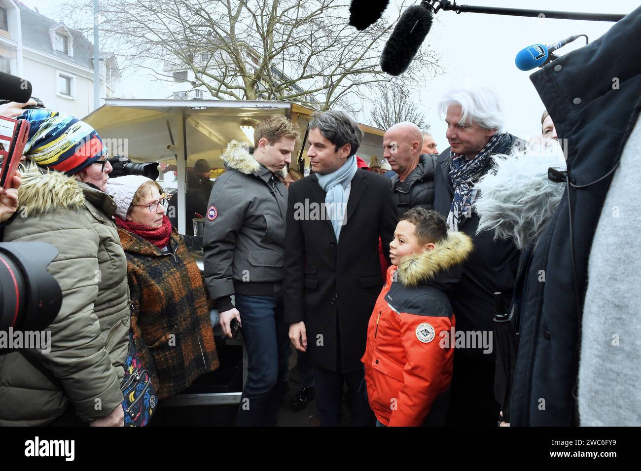 French Prime Minister Gabriel Attal and French Calvados Member of Parliament Fabrice Le Vigoureux meet with members of the public at the Caen market during a visit to talk about purchasing power, in Caen, northwestern France, on January 14, 2024. Photo by Franck Castel/ABACAPRESS.COM Stock Photo