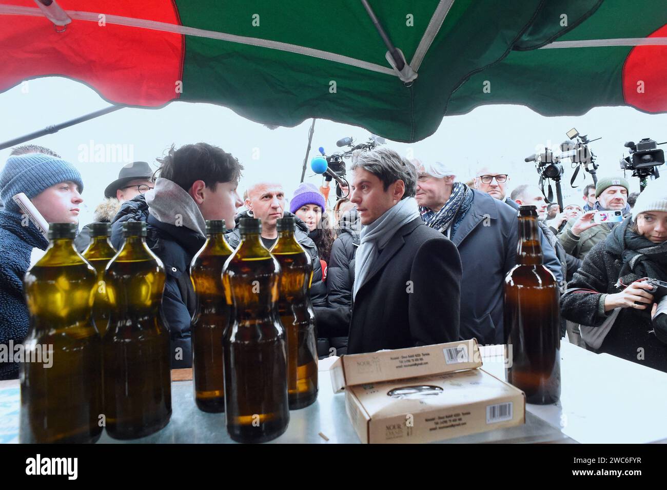 French Prime Minister Gabriel Attal and French Calvados Member of Parliament Fabrice Le Vigoureux meet with members of the public at the Caen market during a visit to talk about purchasing power, in Caen, northwestern France, on January 14, 2024. Photo by Franck Castel/ABACAPRESS.COM Stock Photo