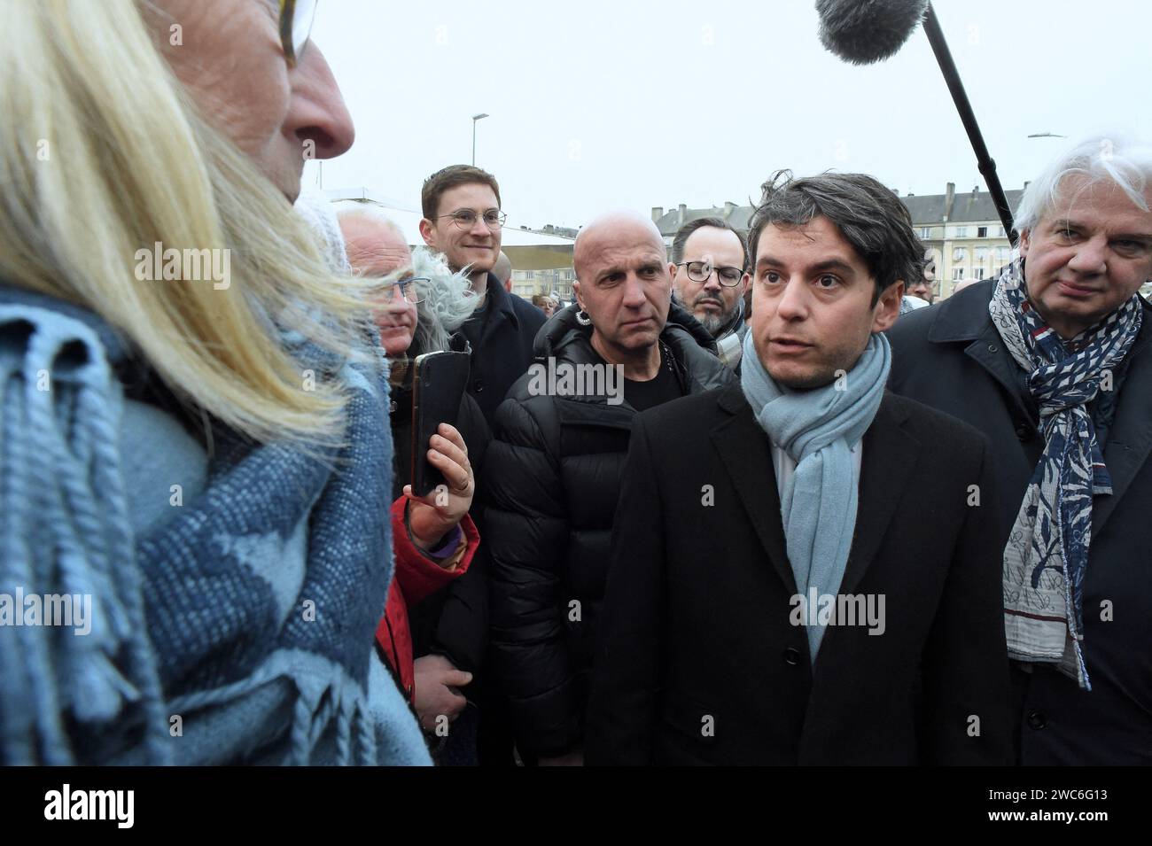 French Prime Minister Gabriel Attal and French Calvados Member of Parliament Fabrice Le Vigoureux meet with members of the public at the Caen market during a visit to talk about purchasing power, in Caen, northwestern France, on January 14, 2024. Photo by Franck Castel/ABACAPRESS.COM Stock Photo