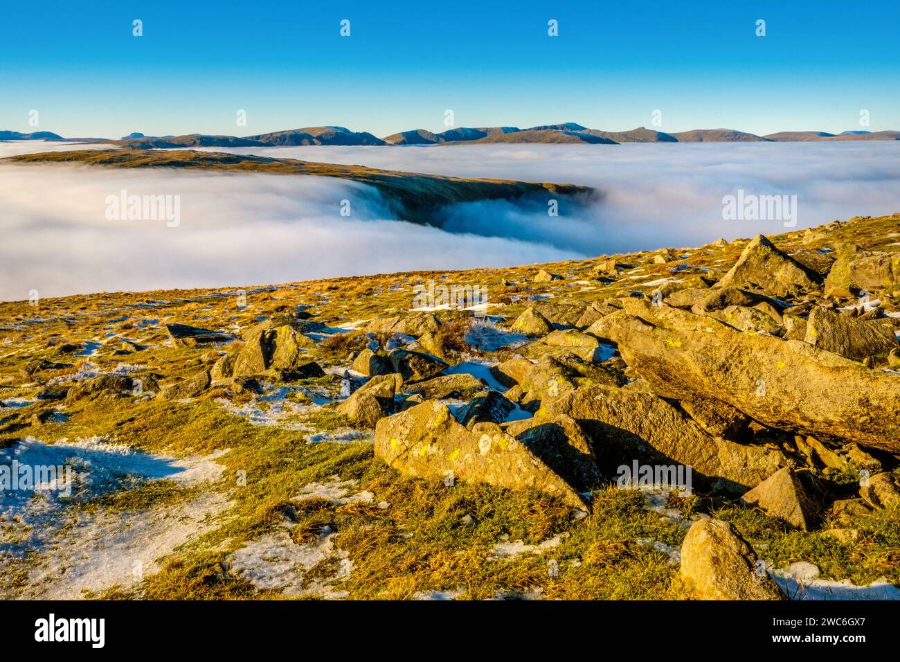The Helvellyn range seen above a cloud inversion / temperature inversion from Thornthwaite Crag in the Lake District National Park, Cumbria, UK Stock Photo
