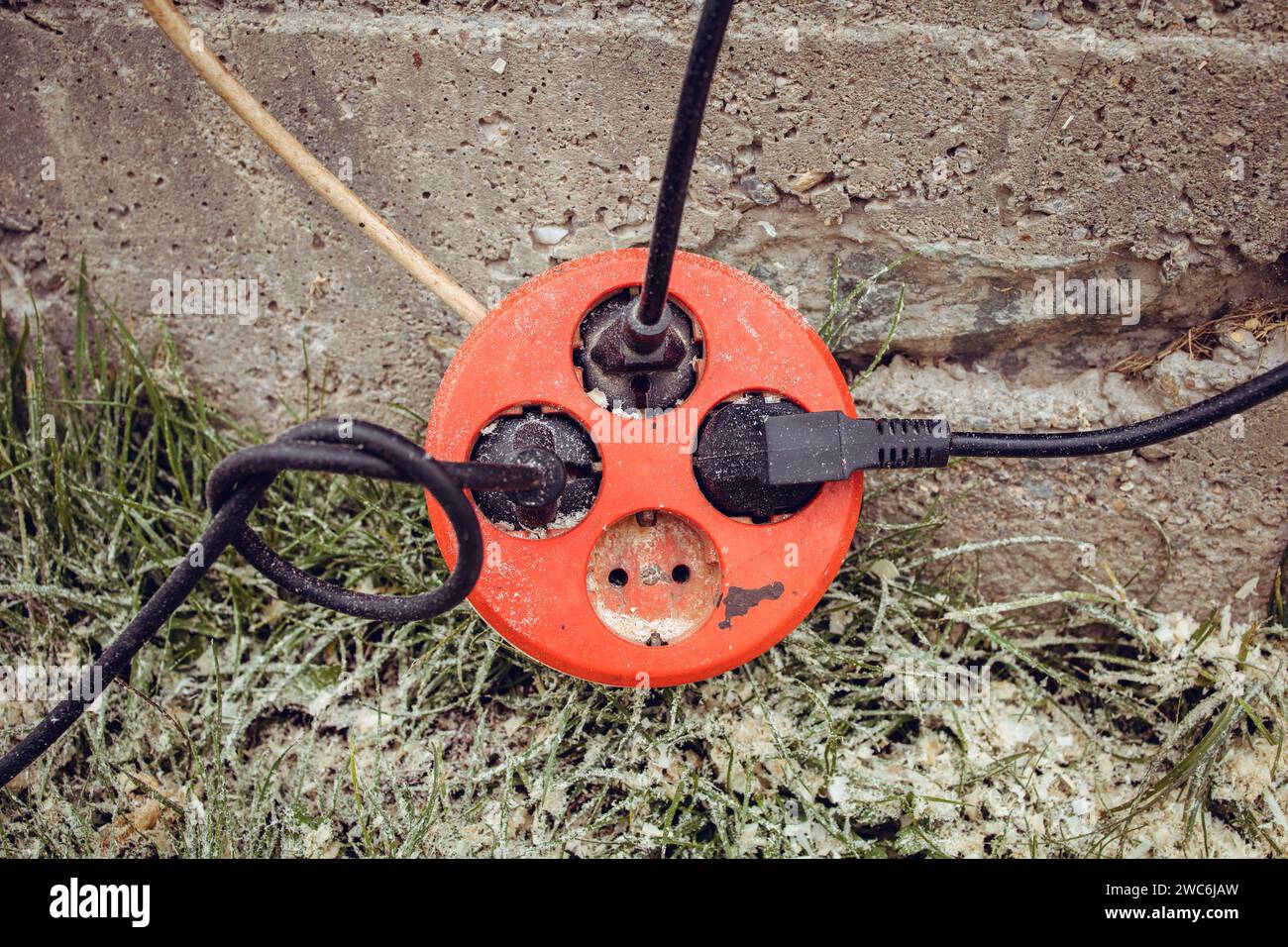 Extension cord, cable with three used sockets Stock Photo Alamy