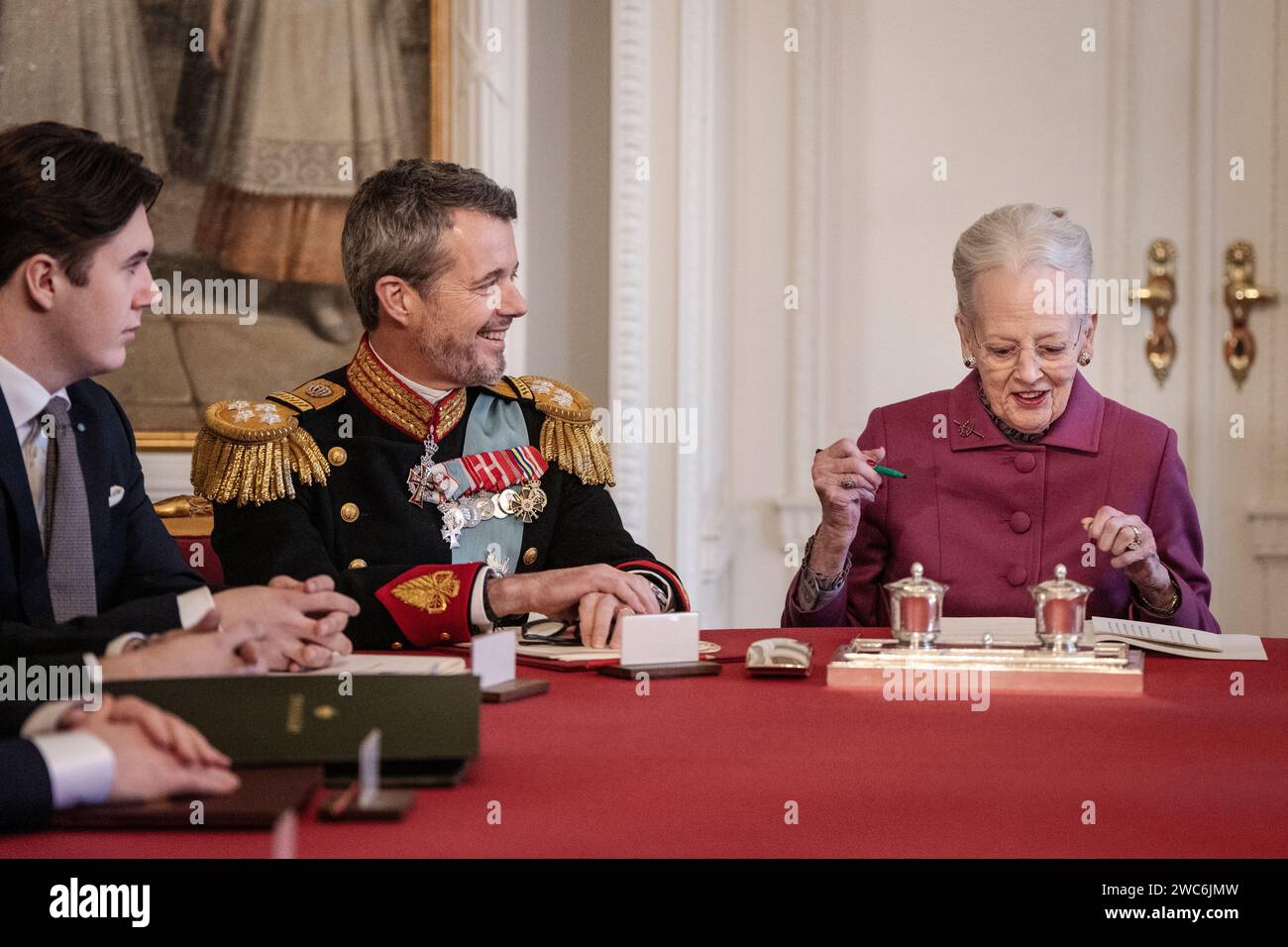 Queen Margrethe signs a declaration of abdication in the Council of