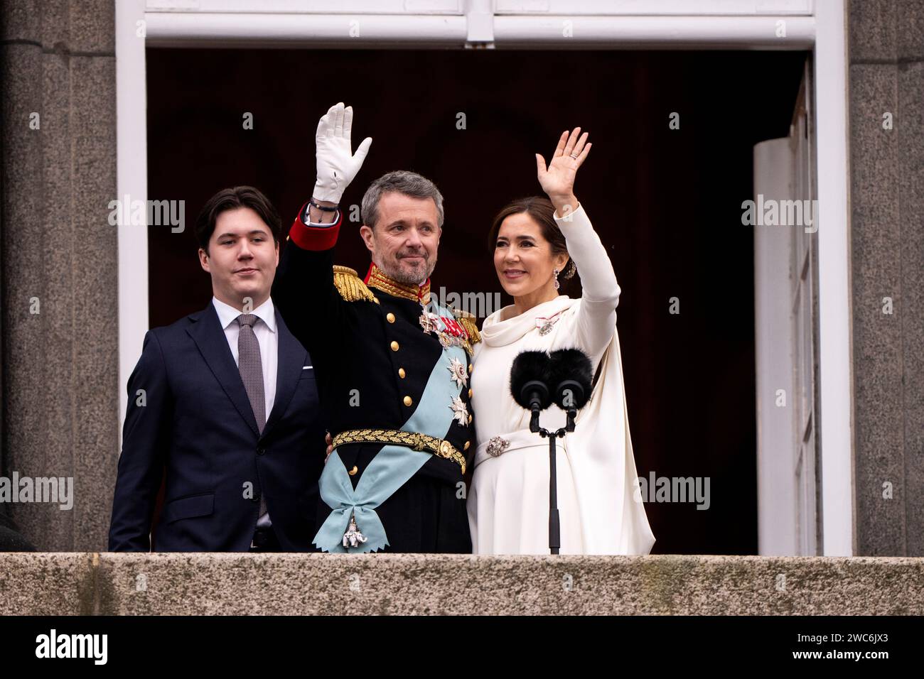 King Frederik X, Queen Mary and Crown Prince Christian waves from the balcony after the proclamation at the Christiansborg Palace Square on Sunday, January 14, 2024. Stock Photo