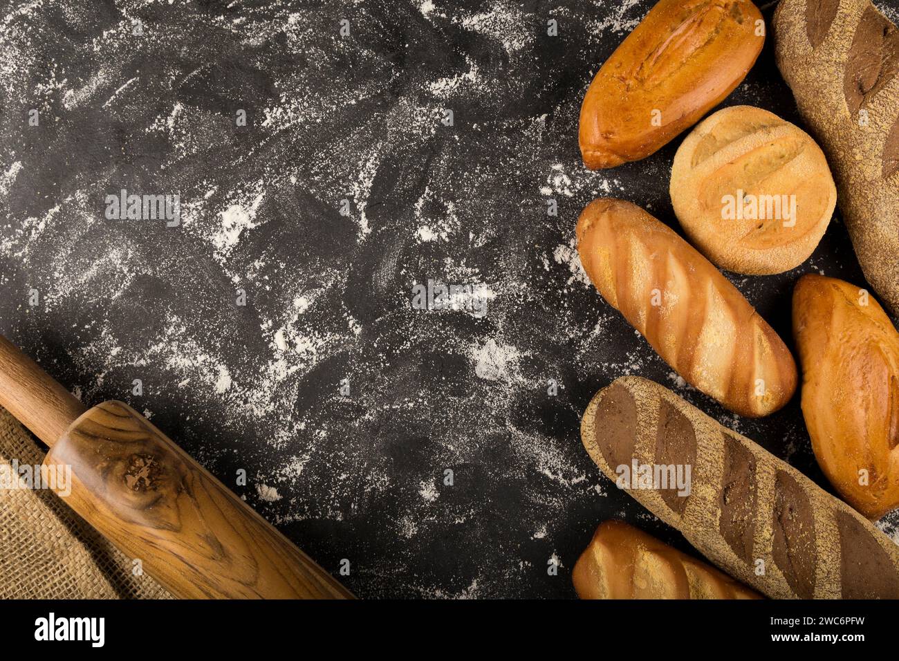 Bakery. Different types of fresh bread on the table. Stock Photo