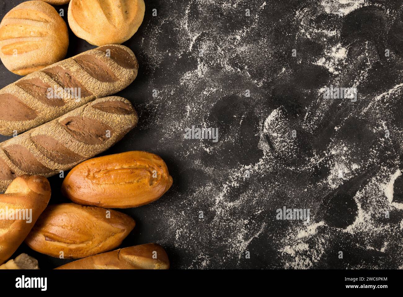 Bakery. Different types of fresh bread on the table. Stock Photo
