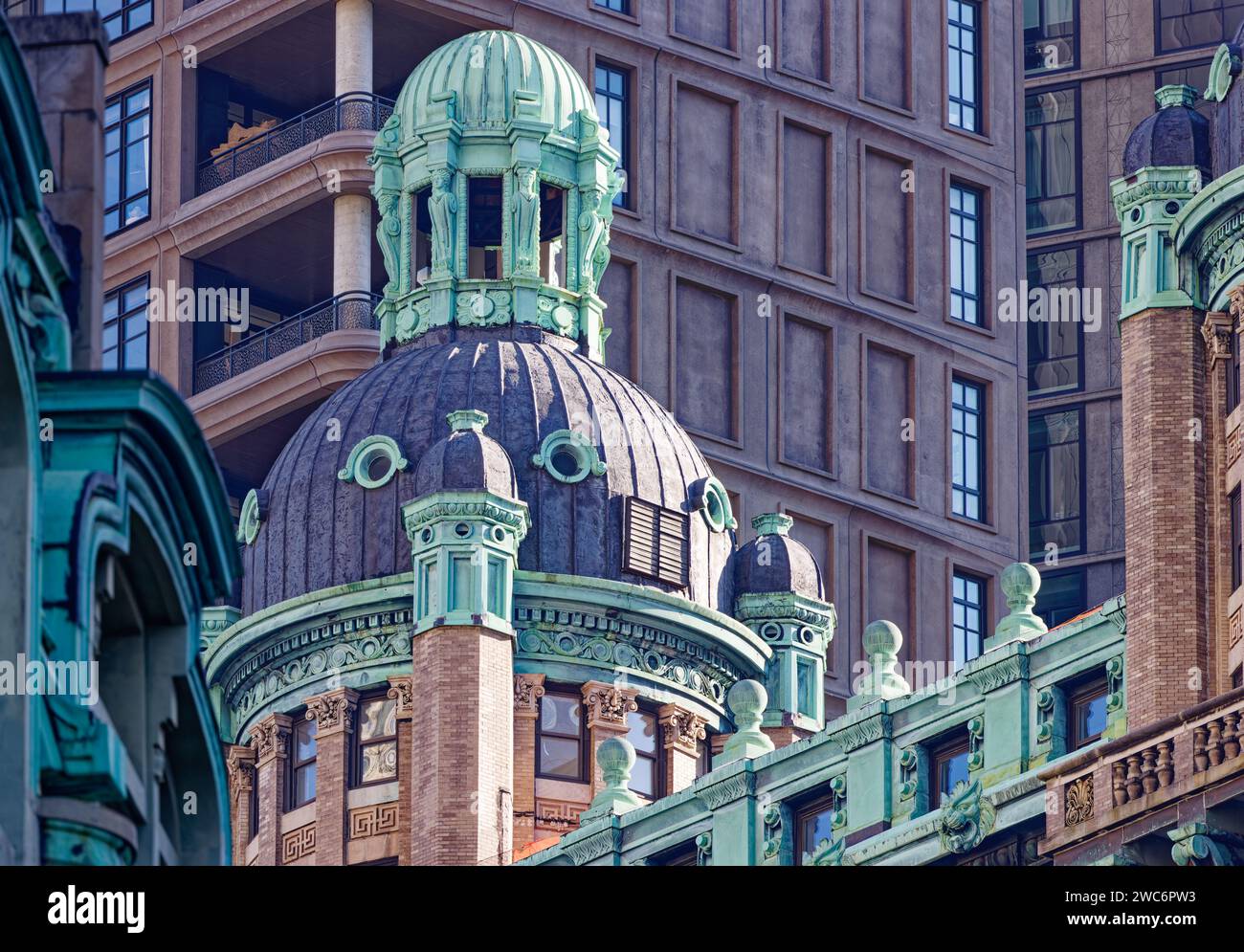 A pair of copper-cupola-topped towers crown 15 Park Row, a NYC Financial District landmark now converted from commercial to residential use. Stock Photo