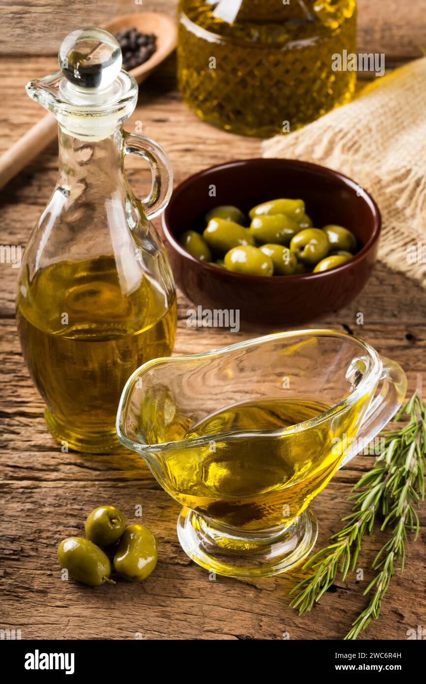 Olive oil. Containers with virgin olive oil and olives Stock Photo Alamy