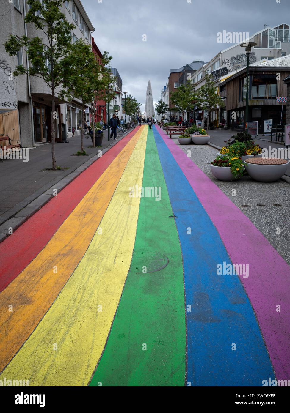 Reykjavik, Iceland - July 15, 2021 : Vibrant rainbow street in Reykjavik, drawing the eye towards the famous Hallgrimskirkja church in the far distanc Stock Photo