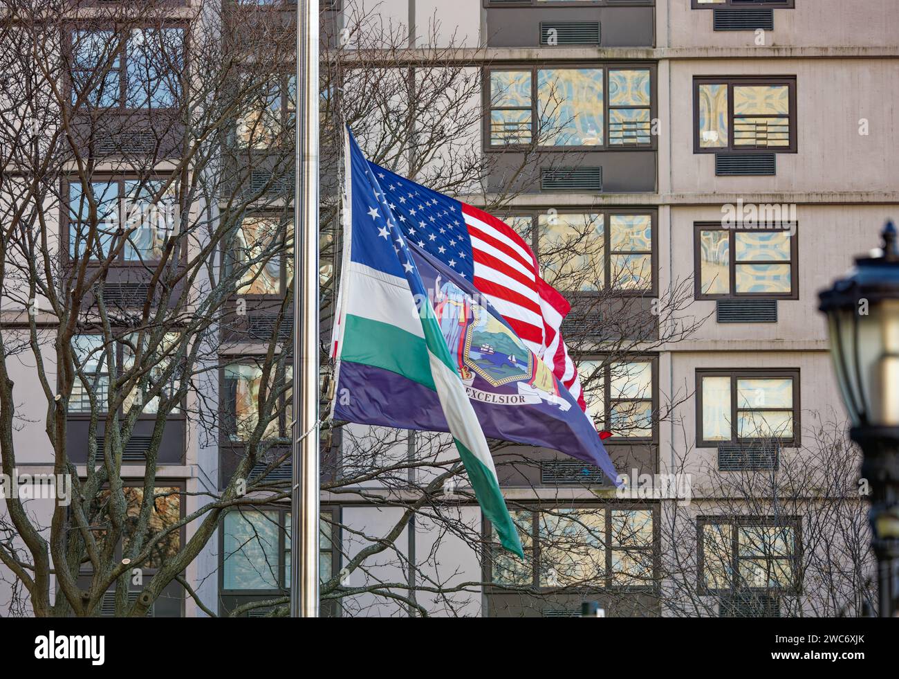 Flags of the United States, New York State, and the New York City Police Department fly at the New York City Police Memorial in Battery Park City. Stock Photo