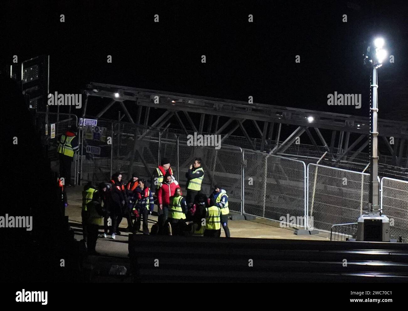 A group of people thought to be migrants are brought in to Dover, Kent, from a Border Force vessel following a small boat incident in the Channel. Picture date: Sunday January 14, 2024. Stock Photo