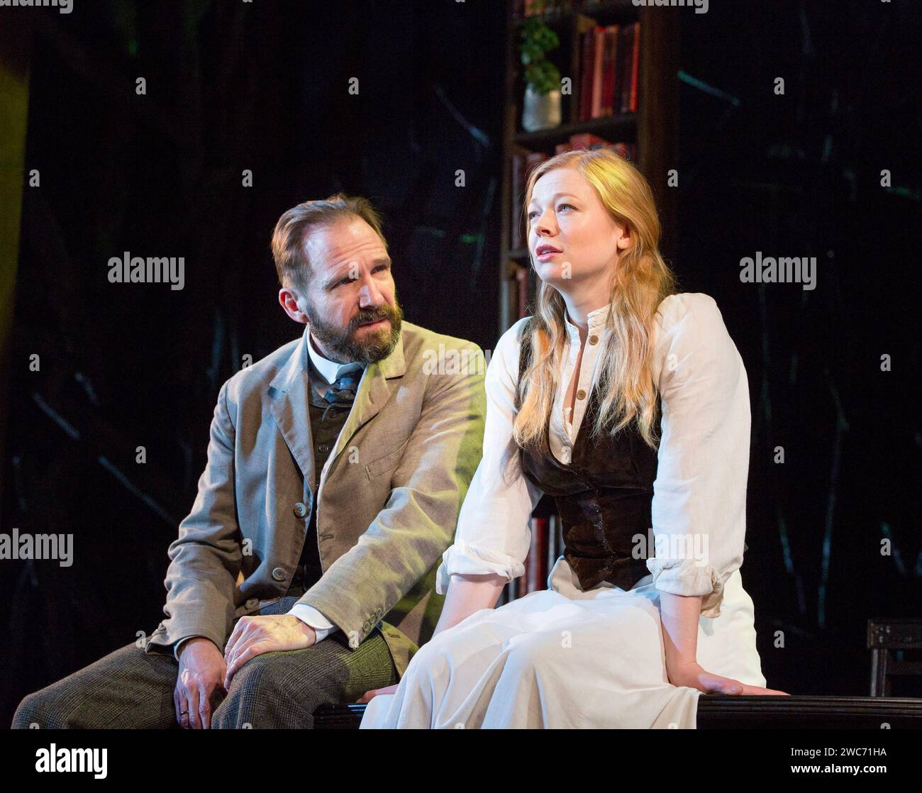 Ralph Fiennes (Halvard Solness), Sarah Snook (Hilde Wangel) in THE MASTER BUILDER by Henrik Ibsen at the Old Vic Theatre, London SE1  03/02/2016 adapted by David Hare  design: Rob Howell  lighting: Hugh Vanstone  director: Matthew Warchus Stock Photo