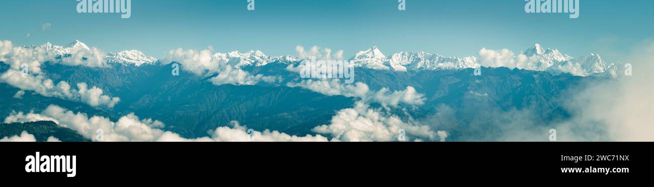 Aerial view of Himalayan mountain range seen from Nagarkot surrounded by clouds. The highest mountains in the world seen from Nepal Stock Photo