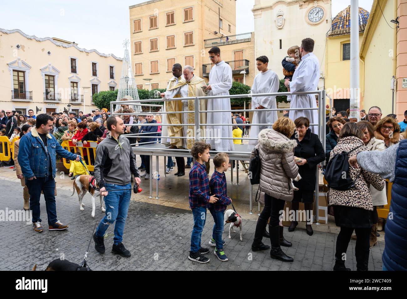 Celebration of St. Anthony's Day with the blessing of the animals by the priests in the street in front of the church, in Alginet, Valencia, Spain Stock Photo