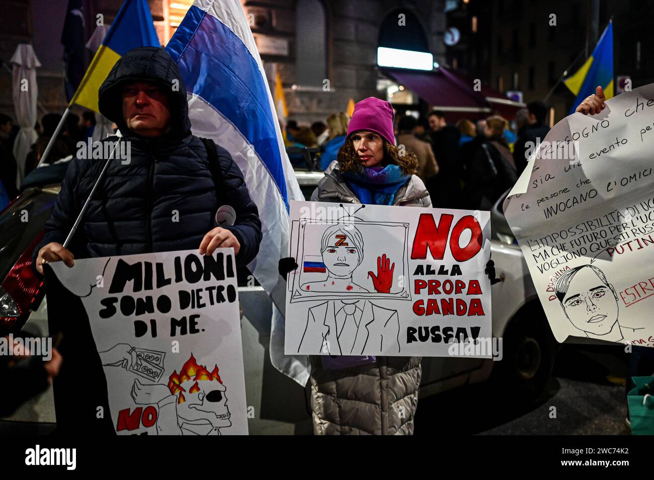 Milan, Italy on January 14, 2024. A woman holds a placard reading ‘No to Russian propaganda' near the Ritter bookshop in Milan, Italy on January 14, 2024 to protest against a meeting on Darya Dugina, daughter of Russian political thinker Aleksandr Dugin. Credit: Piero Cruciatti/Alamy Live News Stock Photo