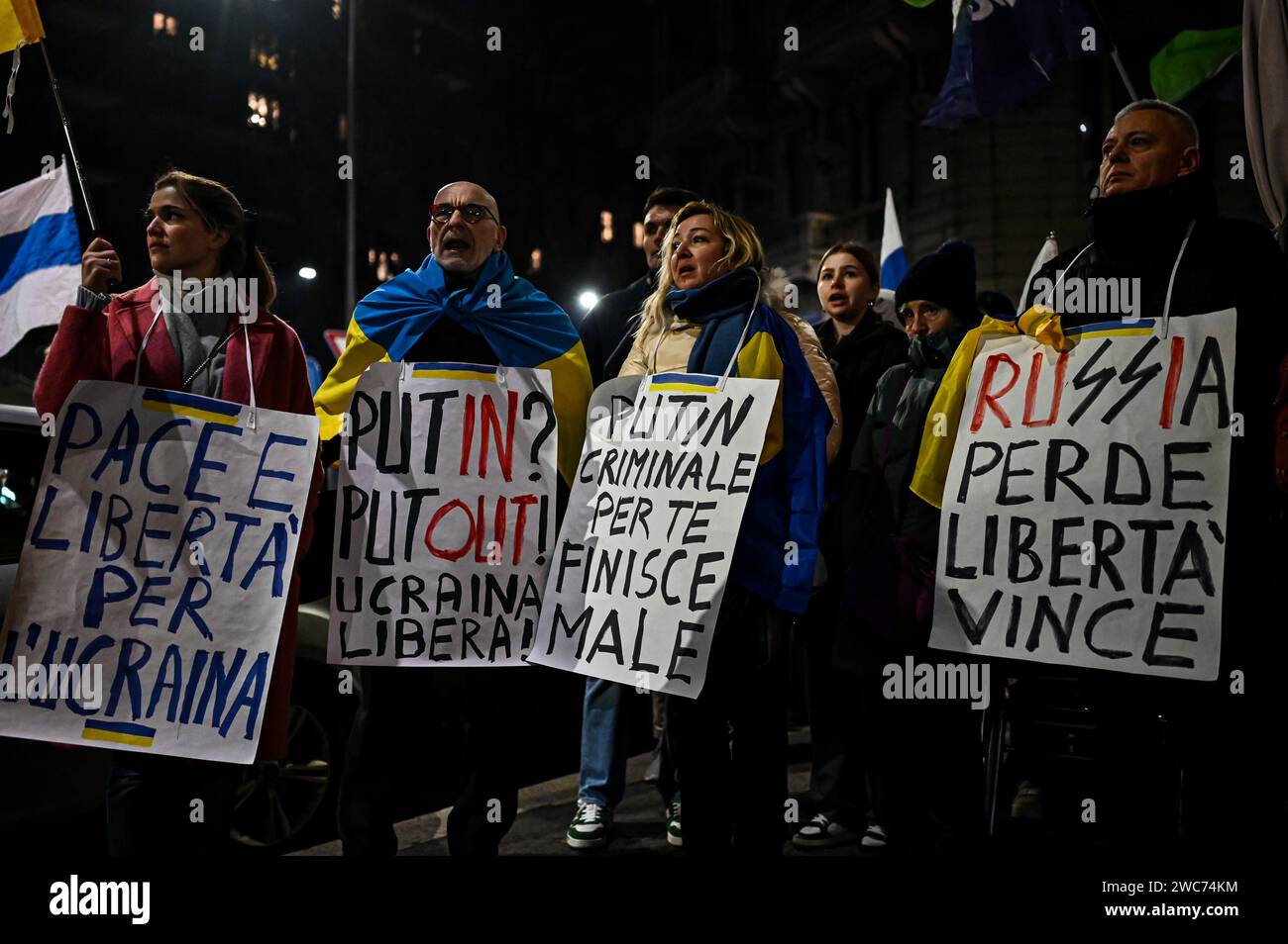 Milan, Italy on January 14, 2024. People with placards gather outside the Ritter bookshop in Milan, Italy on January 14, 2024 to protest against a meeting on Darya Dugina, daughter of Russian political thinker Aleksandr Dugin. Credit: Piero Cruciatti/Alamy Live News Stock Photo