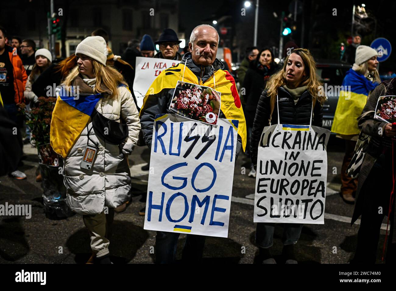 Milan, Italy on January 14, 2024. A man holds a placard reading ‘Russia go home' near the Ritter bookshop in Milan, Italy on January 14, 2024 to protest against a meeting on Darya Dugina, daughter of Russian political thinker Aleksandr Dugin. Credit: Piero Cruciatti/Alamy Live News Stock Photo