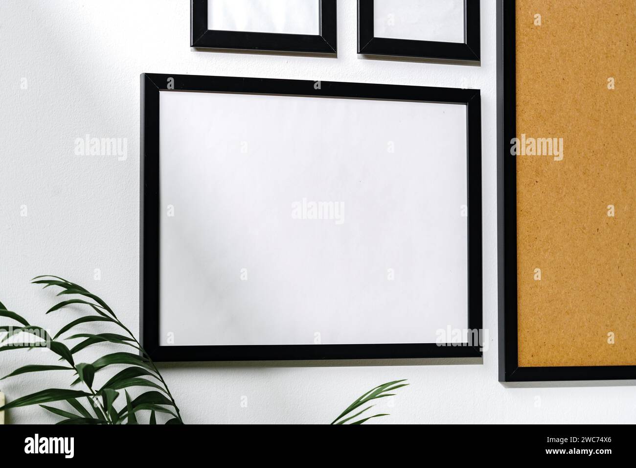 Set of black frames on white wall with copy space Stock Photo
