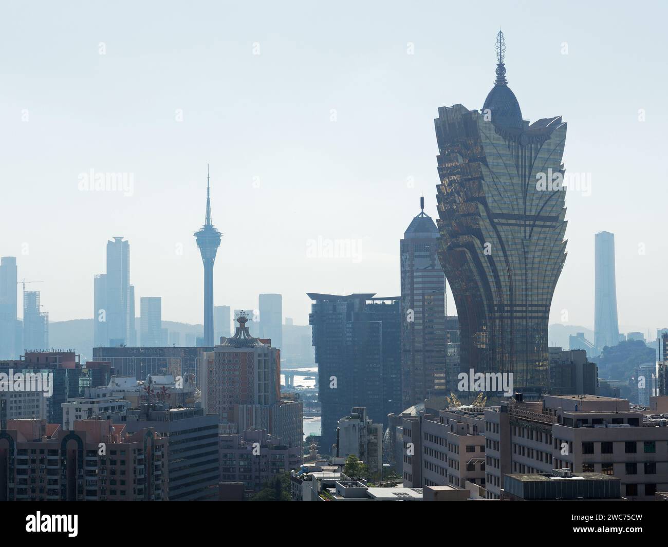 View of the Macau city skyline with iconic buildings silhouetted against the sky Stock Photo