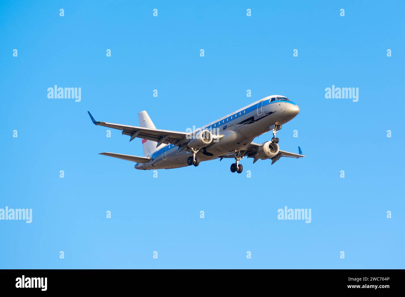 Boryspil, Ukraine - January 2, 2021: Airplane Embraer E175 (SP-LIM) of LOT Polish Airlines in Retro Livery is landing at Boryspil International Airpor Stock Photo