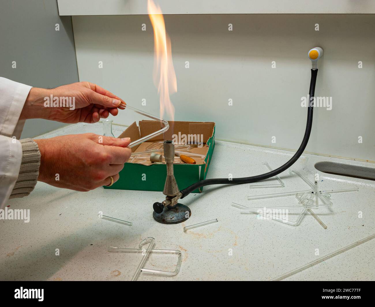 Glass is bent by heating it using a gas burner to make instruments for
