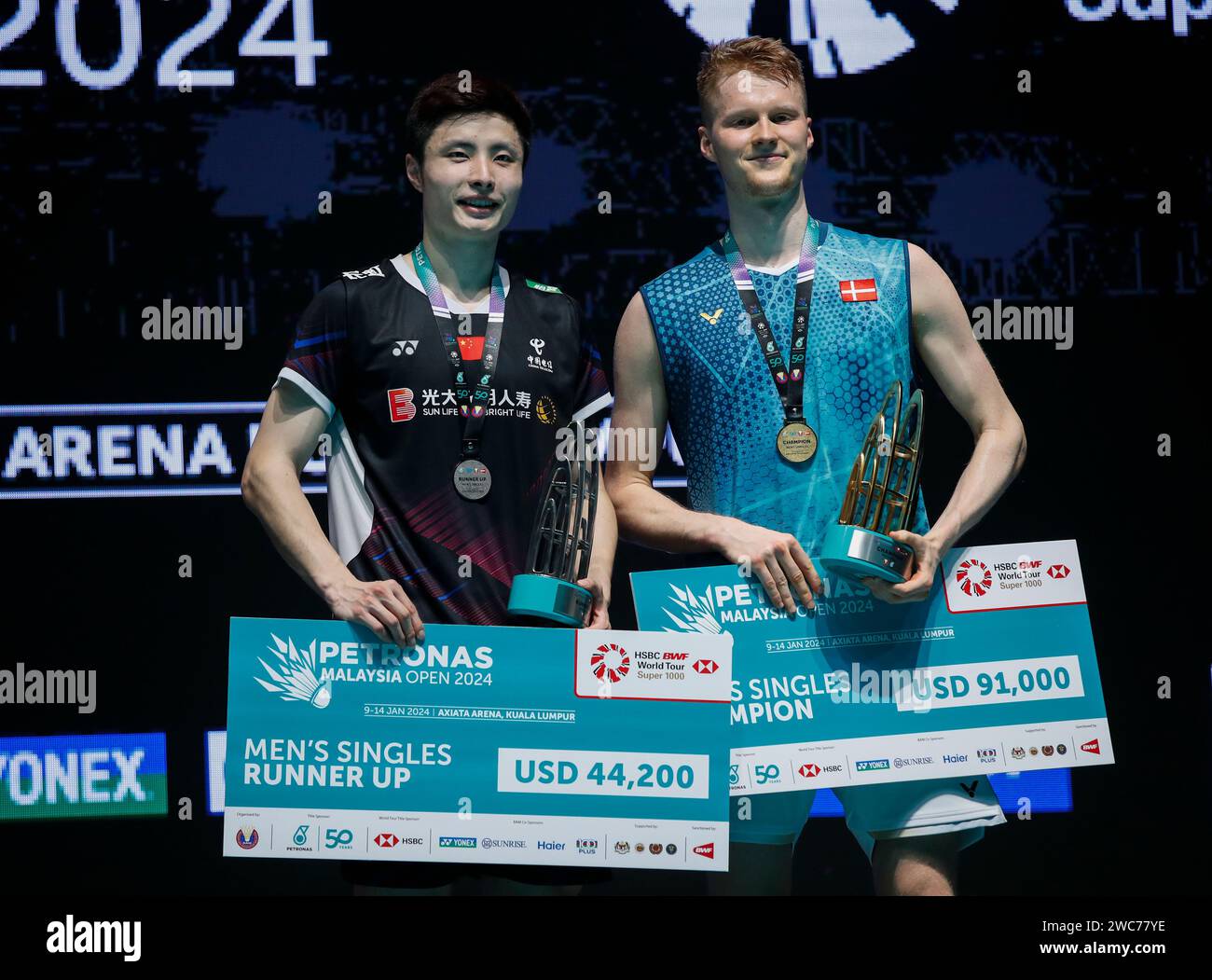 kuala-lumpur-malaysia-14th-jan-2024-anders-antonsen-of-denmark-r-and-shi-yu-qi-of-china-pose-with-their-trophy-at-the-podium-after-the-mens-single-final-match-of-the-petronas-malaysia-open-2024-at-axiata-arena-anders-antonsen-won-with-scores-2121-1413-credit-sopa-images-limitedalamy-live-news-2WC77YE.jpg