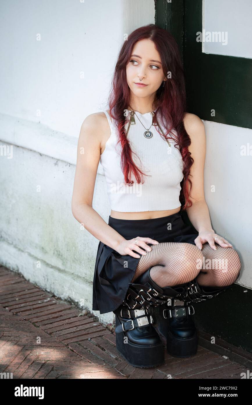 An attractive Alternative female model in an urban setting Stock Photo