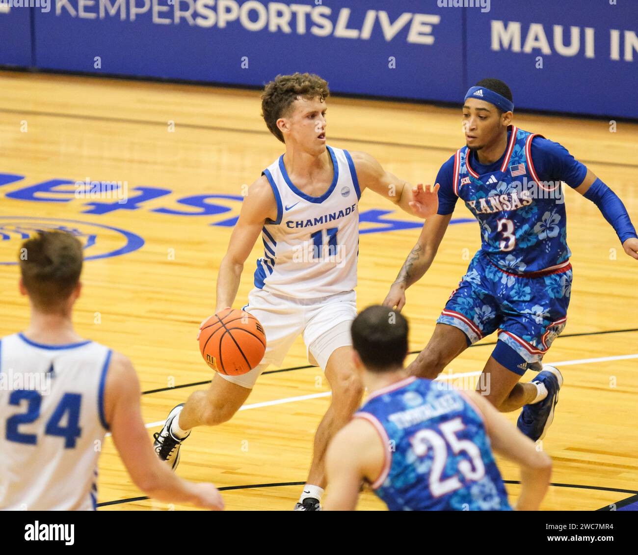 Honolulu, Hawaii, USA. 20th Nov, 2023. Chaminade guard Ross Reeves (11) dribbles the ball during the Allstate Maui Invitational basketball game between the Kansas Jayhawks and the Chaminade Silver Swords at Sofi Arena in the Stan Sheriff Center in Honolulu, Hawaii. Glenn Yoza/CSM/Alamy Live News Stock Photo