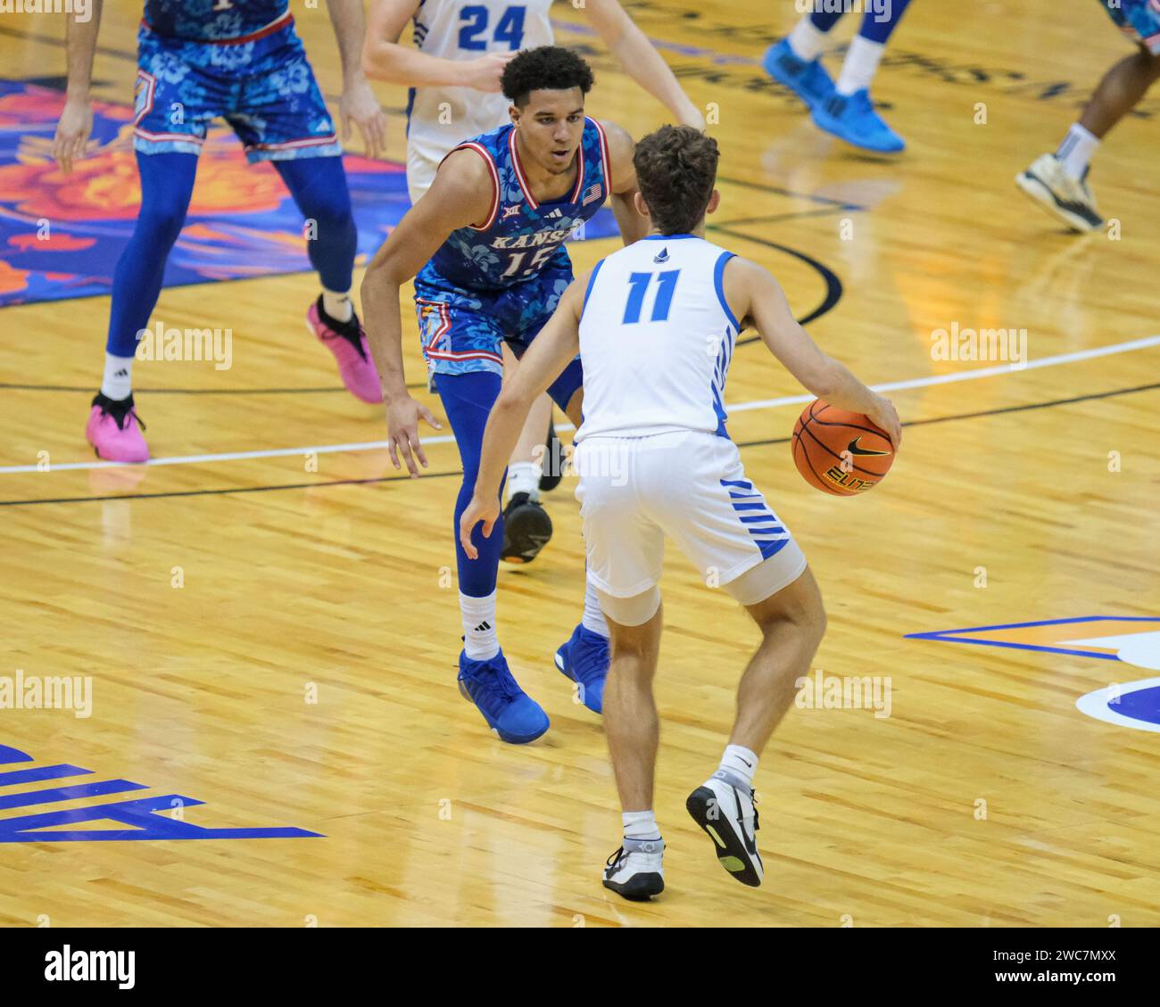 November 20, 2023: Kansas guard Kevin McCullar Jr. (15) guards Chaminade guard Ross Reeves (11) during the Allstate Maui Invitational basketball game between the Kansas Jayhawks and the Chaminade Silver Swords at Sofi Arena in the Stan Sheriff Center in Honolulu, Hawaii. Glenn Yoza/CSM (Credit Image: © Glenn Yoza/Cal Sport Media) (Credit Image: © Glenn Yoza/Cal Sport Media) Stock Photo