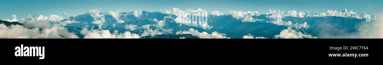 Aerial view of Himalayan mountain range seen from Nagarkot surrounded by clouds. The highest mountains in the world seen from Nepal Stock Photo