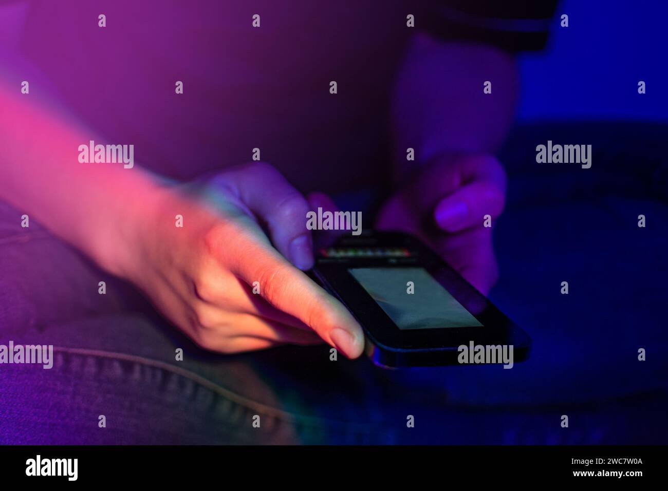 Woman use of cellphone at home. Communicating distantly and using smartphone at home. Stock Photo