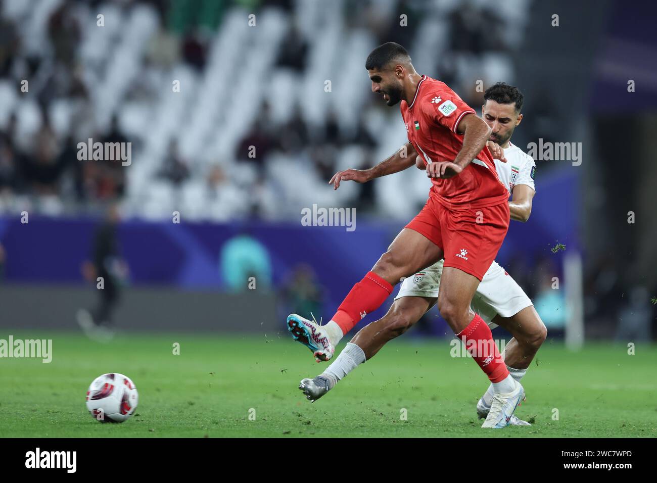 AL RAYYAN, QATAR - JANUARY 14: players of Iran Saman Ghoddos and Palestine in action during the AFC Asian Cup Group C match between Iran and Palestine at Education City Stadium on January 14, 2024 in Al Rayyan, Qatar. Photo SFSI Credit: Sebo47/Alamy Live News Stock Photo