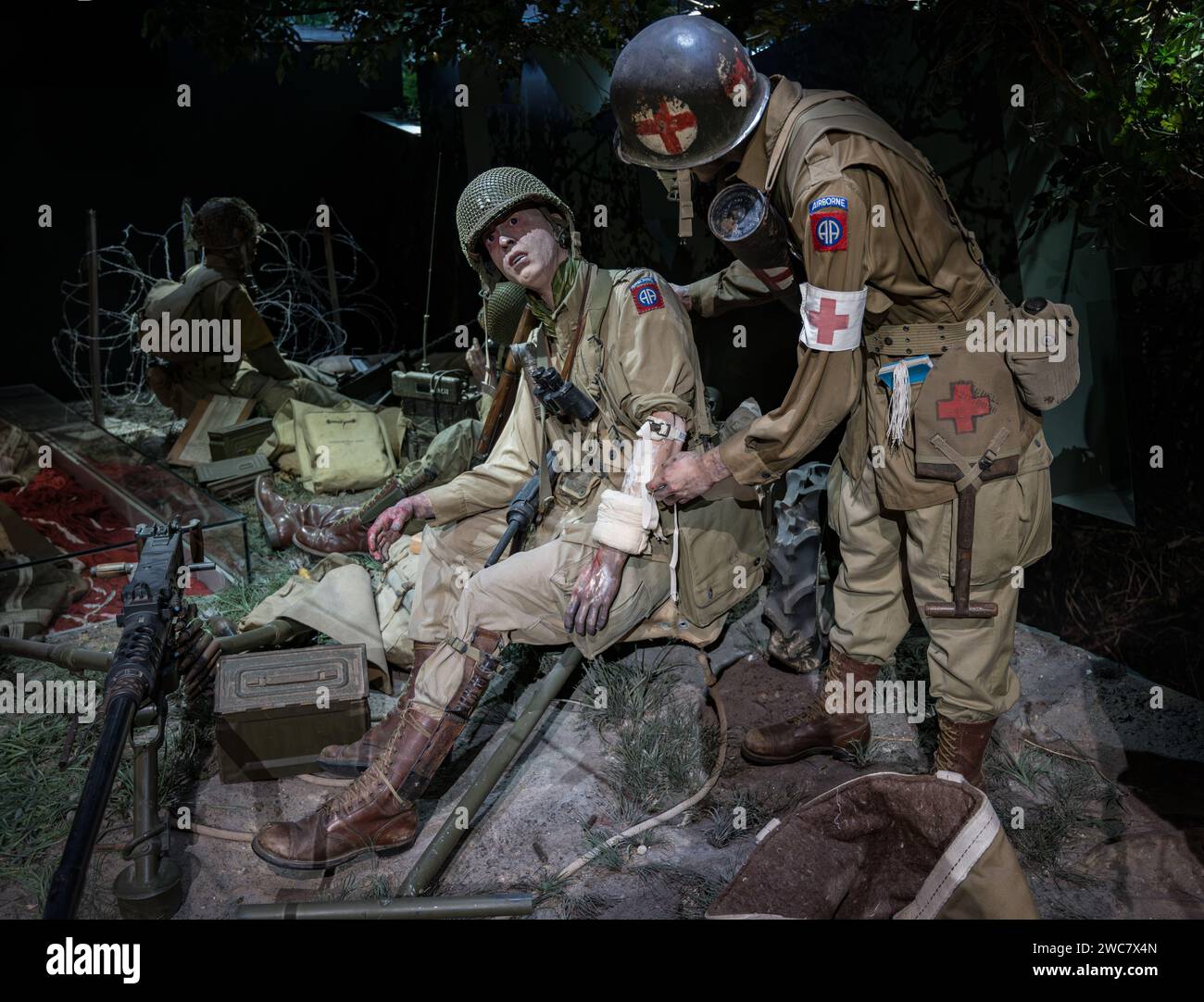 recreation of a scene from World War II of a doctor treating a wounded American soldier on the battlefield Stock Photo