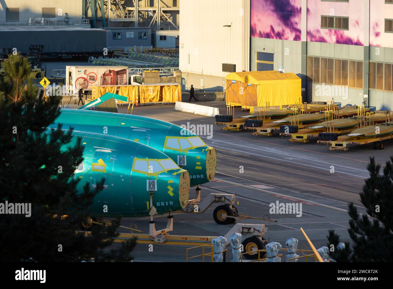 Renton, Washington, USA. 14th January, 2024. Two 737 MAX fuselages, delivered from Spirit AeroSystems, are parked outside the Boeing Renton Factory. The U.S. Federal Aviation Administration has announced increased oversight of Boeing production and manufacturing following an incident on a Boeing Model 737-9 MAX in which the aircraft lost a passenger door plug while in flight. Credit: Paul Christian Gordon/Alamy Live News Stock Photo